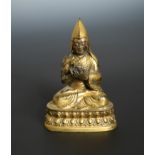 A Tibetan gilt bronze figure of the High Lama Tsongkapa, 19th century,