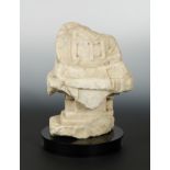 A Chinese white marble fragmentary Buddhist deity on pedestal, in Northern Qi style,