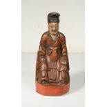 A Chinese carved and painted wooden figure of an ancestor, 19th century,