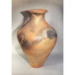 A Chinese red pottery, large ovoid vase, plain, Neolithic or later,