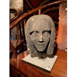 A carved stone head, in medieval style, 19th century, probably English,