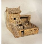 A Chinese unglazed grey pottery model of a farmyard, probably Eastern Han Dynasty,