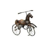 A carved wooden horse mounted as a tricycle, early 20th century,