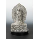 A Chinese carved stone standing figure of Avalokiteshvara with aureole, in Wei Dynasty style,