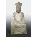 A Chinese grey stone seated figure of Maitreya, in Tang style, crowned,
