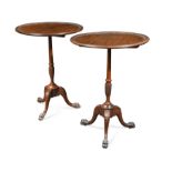 A pair of George III style mahogany tripod occasional tables,