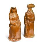 A rare pair of Doulton Lambeth salt glazed figural jugs,