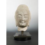 A Chinese limestone head of Buddha, Northern Qi style,