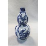 A Chinese blue and white double gourd vase,