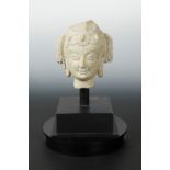 A Chinese pale stone head fragment of a Bodhisattva, perhaps Sui Dynasty,