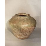 A Chinese green glazed shouldered jar, probably Han Dynasty,