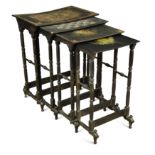 A nest of four black and gilt lacquer occasional tables,