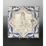 A Qajar large pottery tile, centrally painted with a Persian princess, c. 1900,