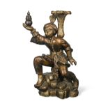 A gilt and gesso carved wood figure of an eastern servant boy,