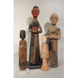 A group of four Chinese carved and painted wood tomb figures, in Han Dynasty style,