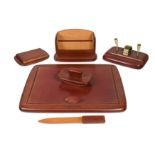 A good quality Italian six-piece cognac leather desk set,