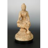 A Chinese white marble Buddhist deity, in Northern Wei style, on a dais,