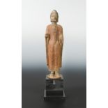A Chinese painted limestone standing figure of Buddha, in Northern Qi Dynasty style,
