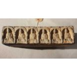 A Chinese grey pottery rectangular brick with an arcade of six Buddhas, in Tang Dynasty style