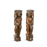 A pair of carved walnut wall brackets, probably 19th century,