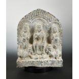 A Chinese limestone Buddha triad group stele, in Northern Wei Dynasty style,