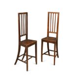 A pair of fruitwood stick back correction chairs, mid 19th century,