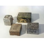 A group of three Chinese decorative stone boxes and a relief carved block,