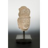 A Chinese sandstone crowned head of Avalokiteshvara, in Tang Dynasty style,