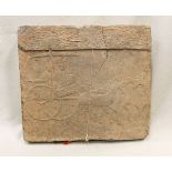 A Chinese grey pottery architectural tile relief, perhaps Han Dynasty,