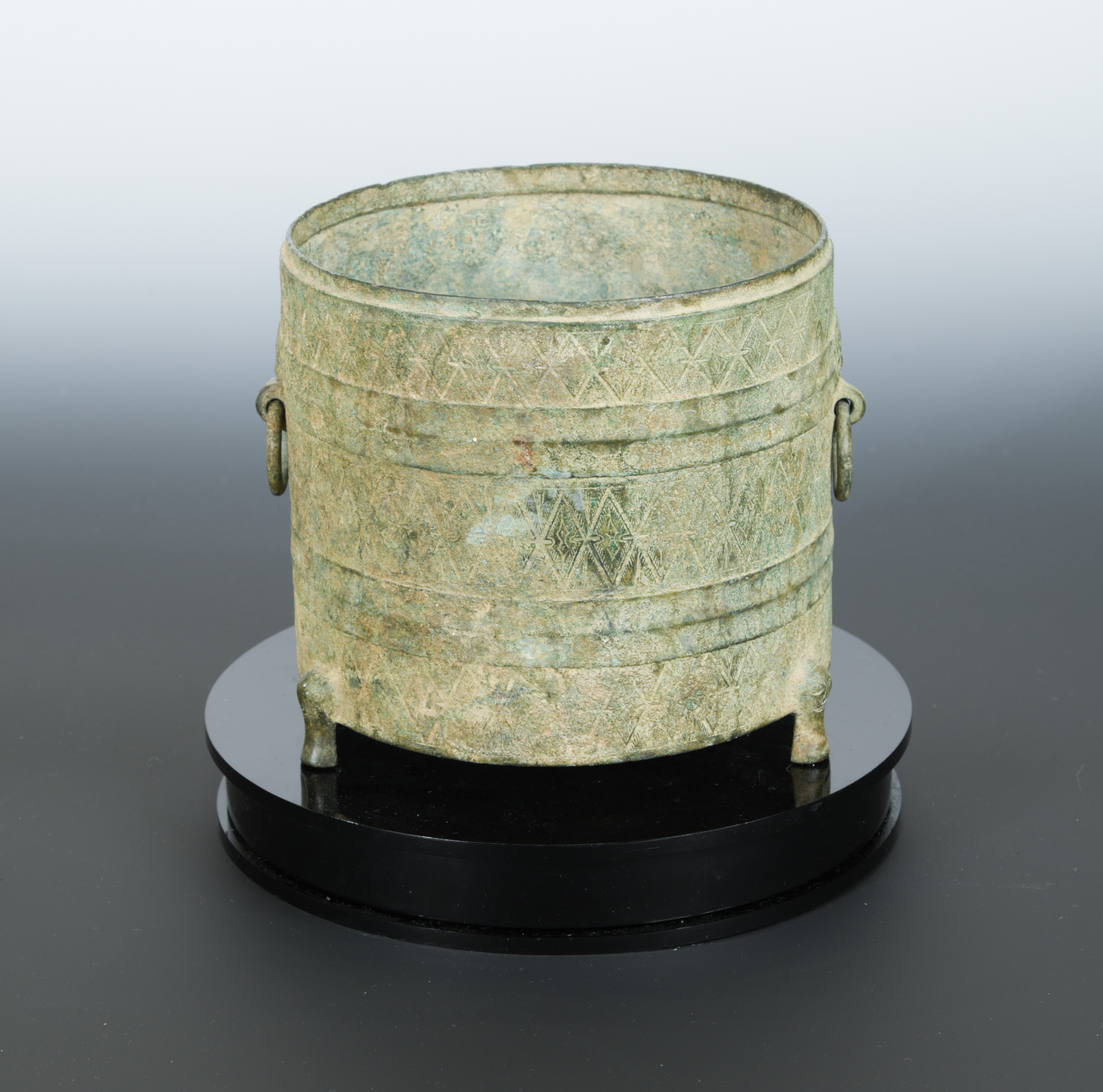 A Chinese bronze tripod cylindrical vessel Zun, probably Warring States,