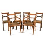 A set of twelve Colonial rosewood dining chairs,