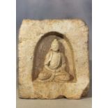 A Chinese cream stone figure of a seated Buddha in a niche, in 5-6th century style,