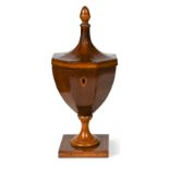 A George III partridge wood pedestal urn-shaped tea caddy,