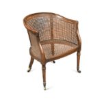 A Regency mahogany caned library bergere tub chair,