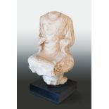 A Chinese white marble seated Buddha on a pedestal, headless, Northern Wei style,