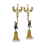 A pair of 19th century French bronze and ormolu figural candelabra,