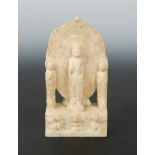 A Chinese white marble Buddhist triad stele with aureole, in Northern Qi style,