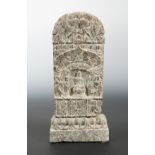 A Chinese brown mottled stone Buddhist small votive stele, possibly Northern Wei Dynasty,