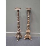 A pair of Italian giltwood floor standing candlesticks 99cm high approx