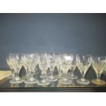 A quantity of cut glass and other decanters, champagnes, wines and other glassware