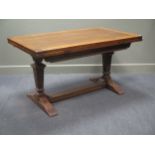 An oak drawleaf dining table 137 x 83cm
