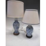 Two blue and white baluster vase lamps of different design, tallest 50cm (with shade)
