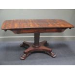 A William IV rosewood sofa table on lion paw feet (71.5 x 92 x 70cm closed)