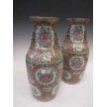 A pair of Chinese Canton vases c1860, Qing Dynasty, decorated with butterflies and flowers