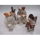 A Beswick pottery bulldog, 'Basford British Mascot', a Royal Doulton seated bulldog, a group of