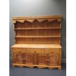 A reproduction Victorian style pine dresser and rack 181cm wide