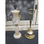 A brass door stop with loop handle and an alabaster lamp (A/F) (2)
