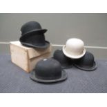 A Bates Polo helmet and 6 bowler hats