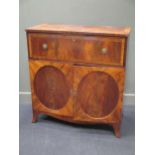 A George III mahogany secretaire cabinet, the fall front above a pair of cupboard doors, with