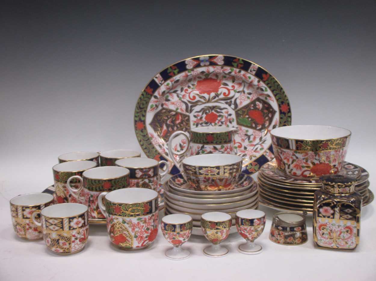 A quantity of matched Royal Crown Derby and Crown Derby imari plates, cups, slop bowl etc